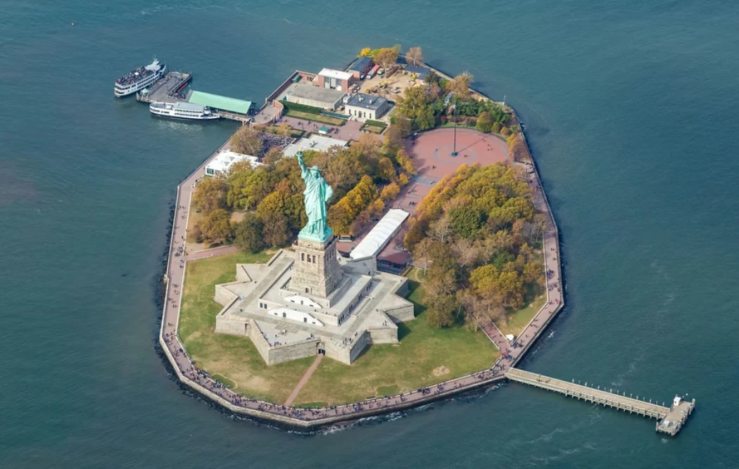 The aerial view of Liberty Island seen from the helicopter tour