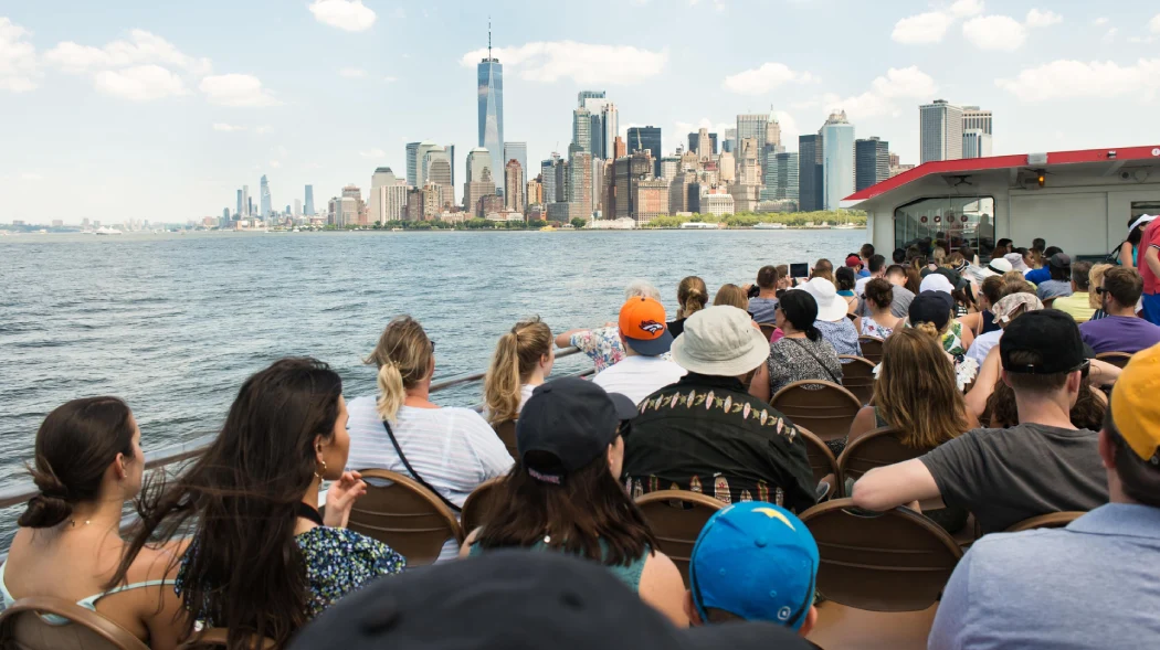Visitors enjoying the Liberty Express cruise on the deck