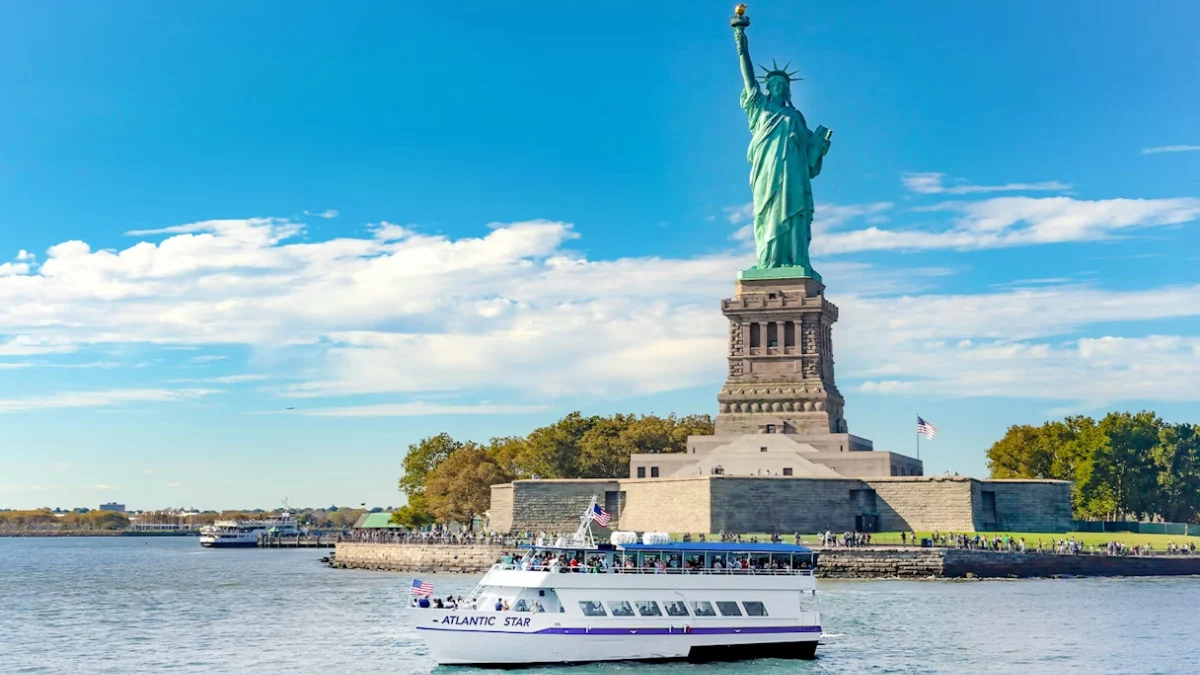 The Liberty Express Cruise passing near the Statue of Liberty on a clear day