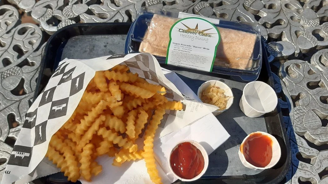 Vegan avocado bacon wrap and fries in the Crown cafe